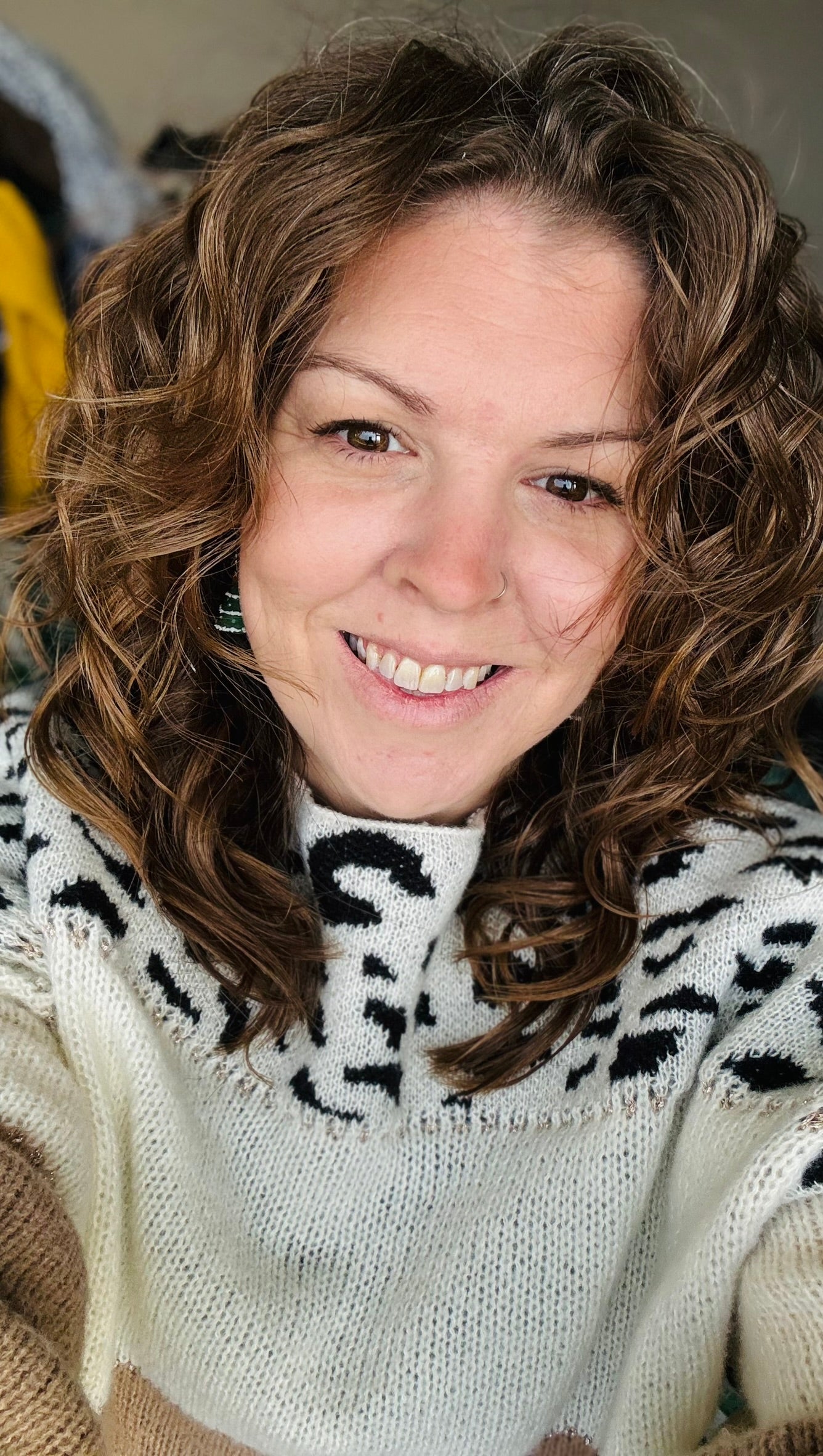 Picture of Annica who has brown curly hair, brown eyes and s smiling.