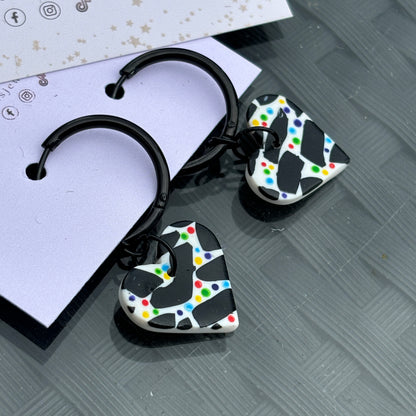 Black and white hearts with rainbow coloured dots